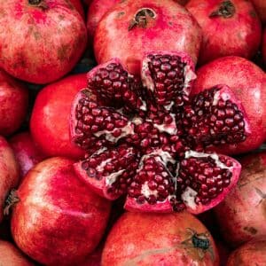 red pomegranate fruit at street market group of pomegranates